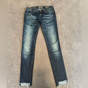 Buckle black skinny jeans